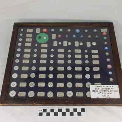 Storekeeper's button display in wood frame with glass front