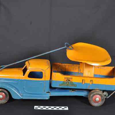 Dark yellow and blue dump truck with seat