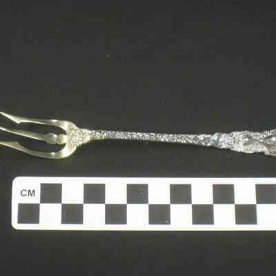 Silver gilt serving fork with 3 tines in shape of a trident