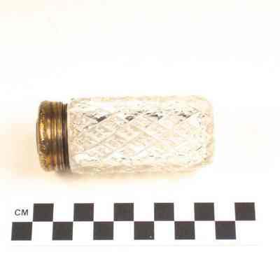 Cut glass bottle with gold washed cap