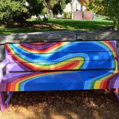 Bench with painted rainbow