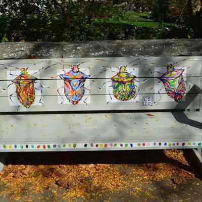 Bench with painted bugs
