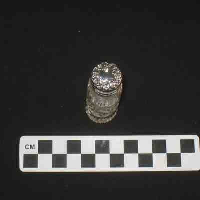 Cut glass perfume bottle with silver cap