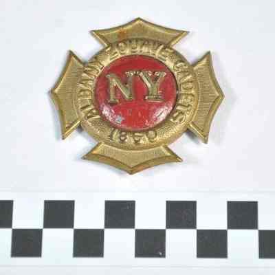 Hat badge shaped like fireman's badge