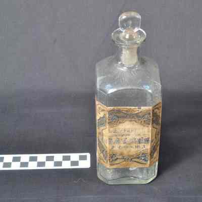 Pharmacy bottle with paper label--"BAY RUM"