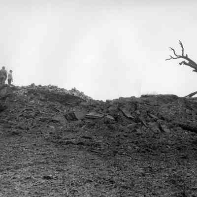 Halltown dynamite truck explosion - explosion damage, men to left