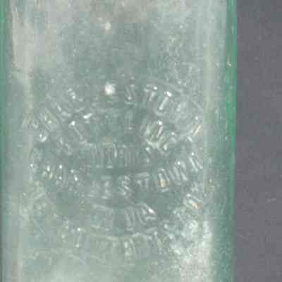 Green glass beverage bottle