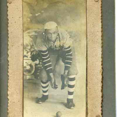 Unidentified African American man playing baseball