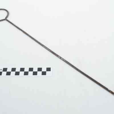 Metal pick with large ring at one end