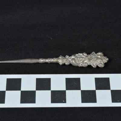 Silver colored metal punch