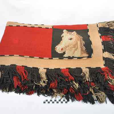 Heavy blanket of knitted wool for use in a carriage or buggy