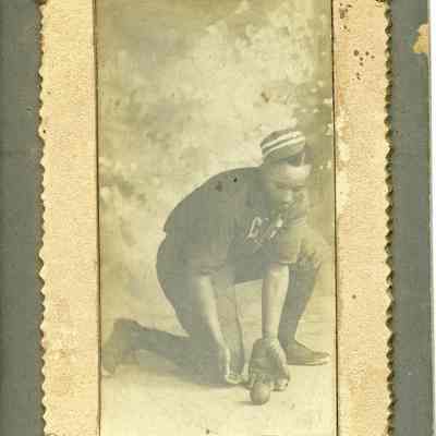 Unidentified African American man playing baseball