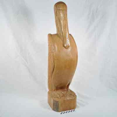Wood carving of pelican