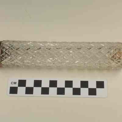 Cut glass bottle with gold washed silver cap