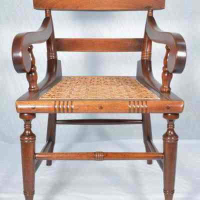 Walnut armchair with caned seat