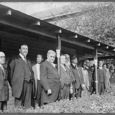 Group of men standing on a porch