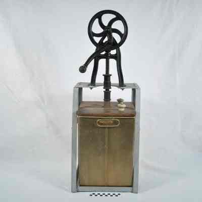 Iron, wood and tin butter churn