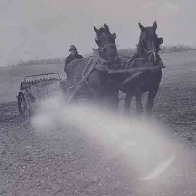 Oliver M. Merchant on a manure spreader at the Merchant's farm in Bardane