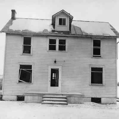 Halltown dynamite truck explosion - house with broken windows