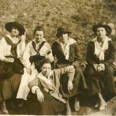 Mary McDonald Porterfield and 4 women sitting on a log