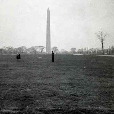 Individuals standing in front of Washington Monument, 1938
