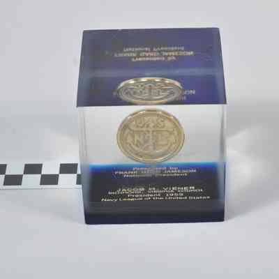 Souvenir coin embedded in clear lucite block
