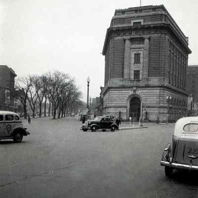 Unknown building and street with cars