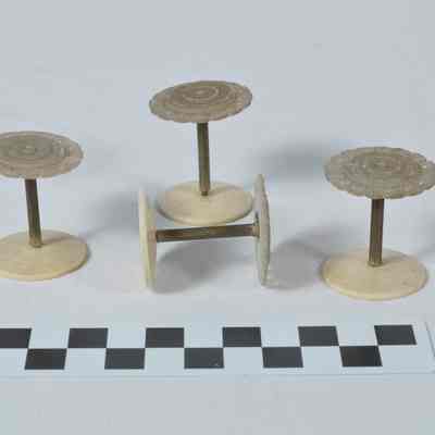 Set of four spools for holding thread