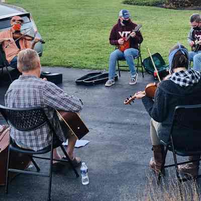 Musicians playing Old Time music in driveway in Locust Hill