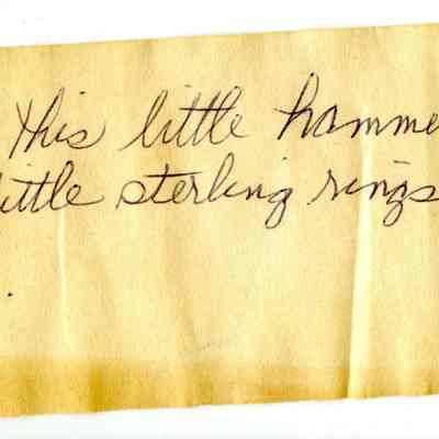 Note attached to small goldsmith's hammer