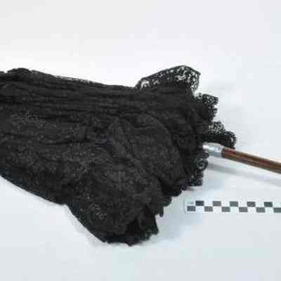 Black silk parasol trimmed with black lace