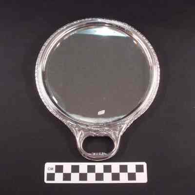 Circular sterling silver hand mirror