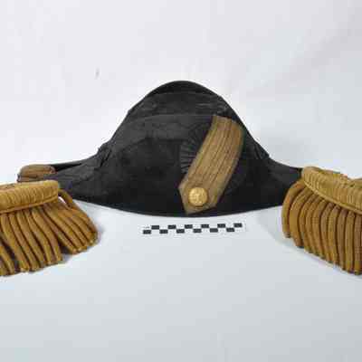 Epaulets and an admiral's hat in a black tin box