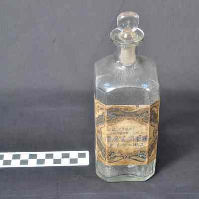 Pharmacy bottle with paper label--"BAY RUM"