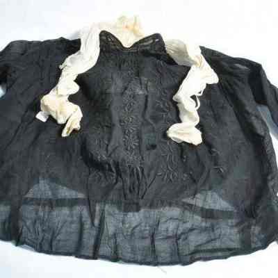 Black cotton blouse with white ribbing around collar