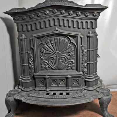 Rectangular, black, cast iron parlor stove