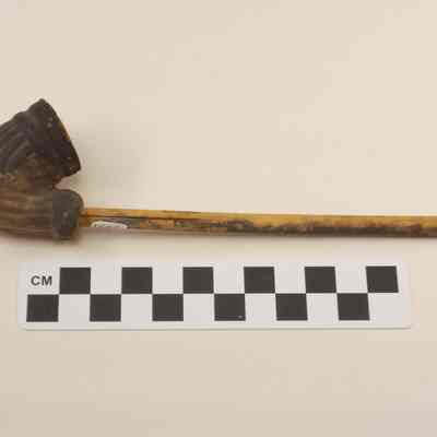 Clay pipe with wood stem