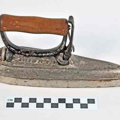 Tear drop shaped iron with wooden handle