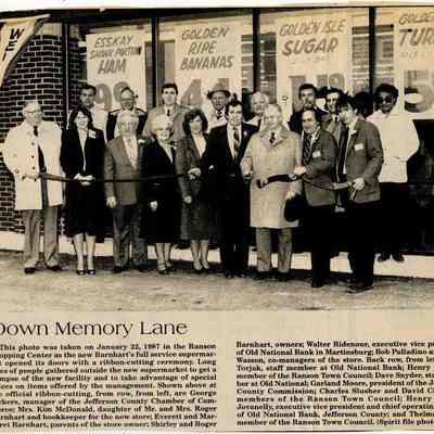 Individuals standing in front of Ranson Shopping Center opening day, 1987