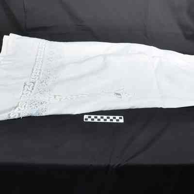 Woman's two-piece white linen dress
