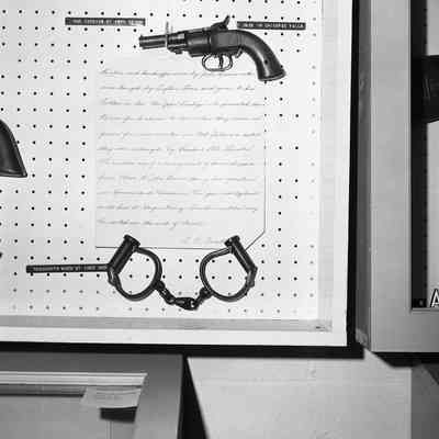 John Brown pistol and handcuffs