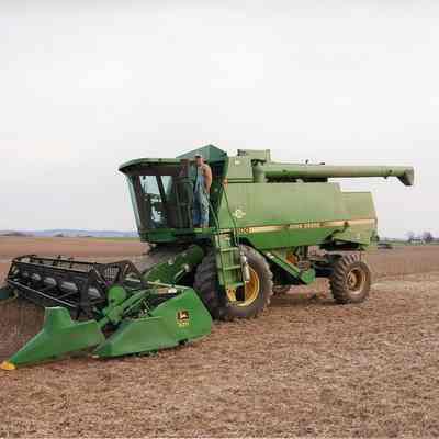 Combining soybeans in a field across from Altona