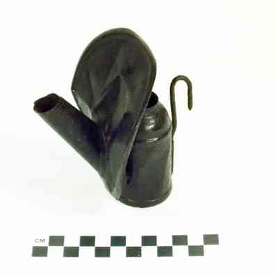 Tin miner's oil-wick cap lamp with shield