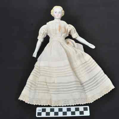 Ceramic doll with blue eyes and blond hair