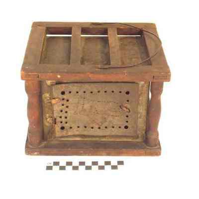 Tin and wood foot warmer