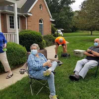 Neighborhood gathering in Shepherdstown with people wearing masks