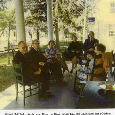 Men and women on porch at 311 South Samuel Street