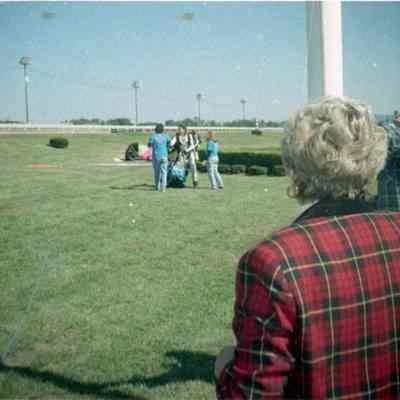 Individuals standing in infield at Charles Town Race Track