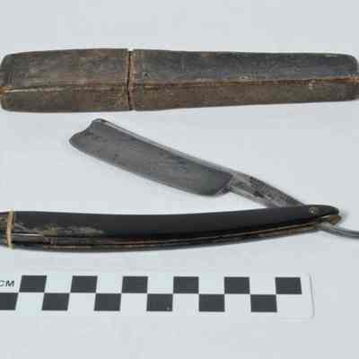 Razor with steel blade and wood handle