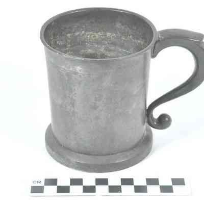 Pewter cup with curved handle
